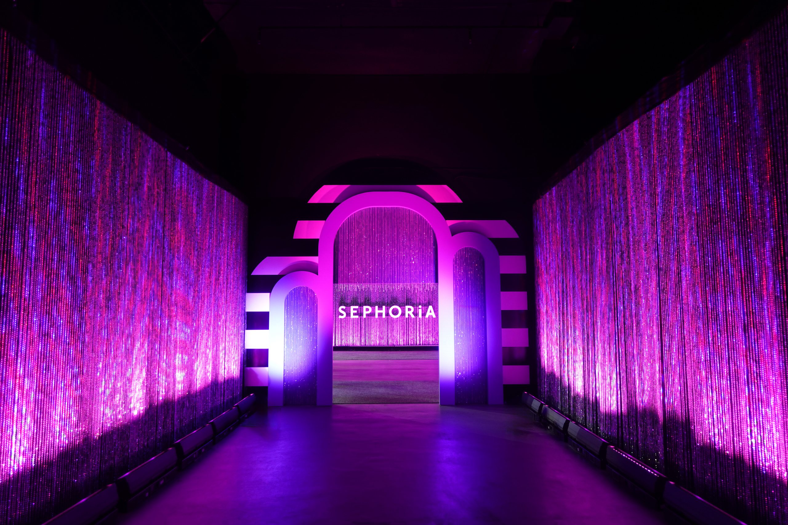 A neon-lit walk-through tunnel entrance at SEPHORiA inside Magic Box
