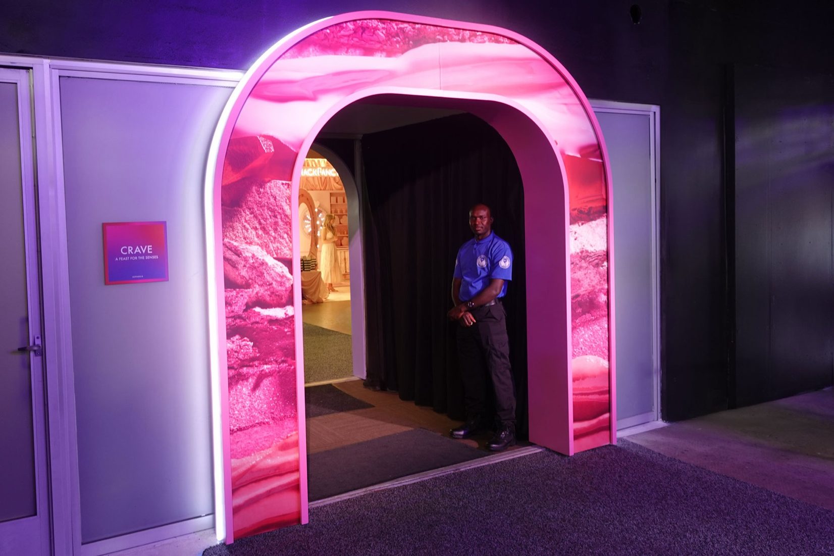 Pink illuminated archway entrance at SEPHORiA activation