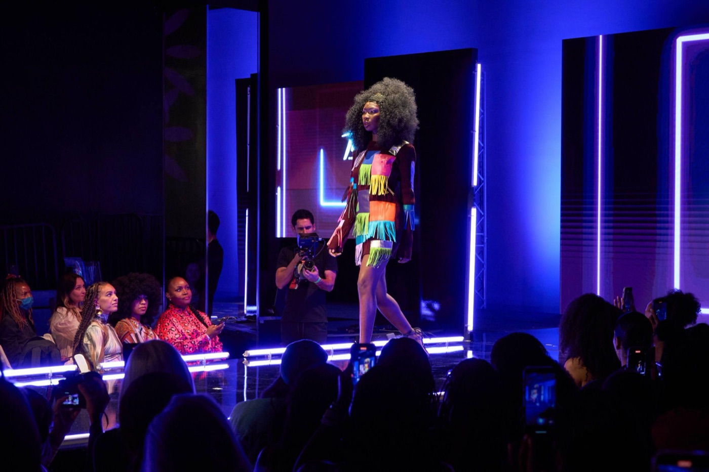 A runway show cutting through the space